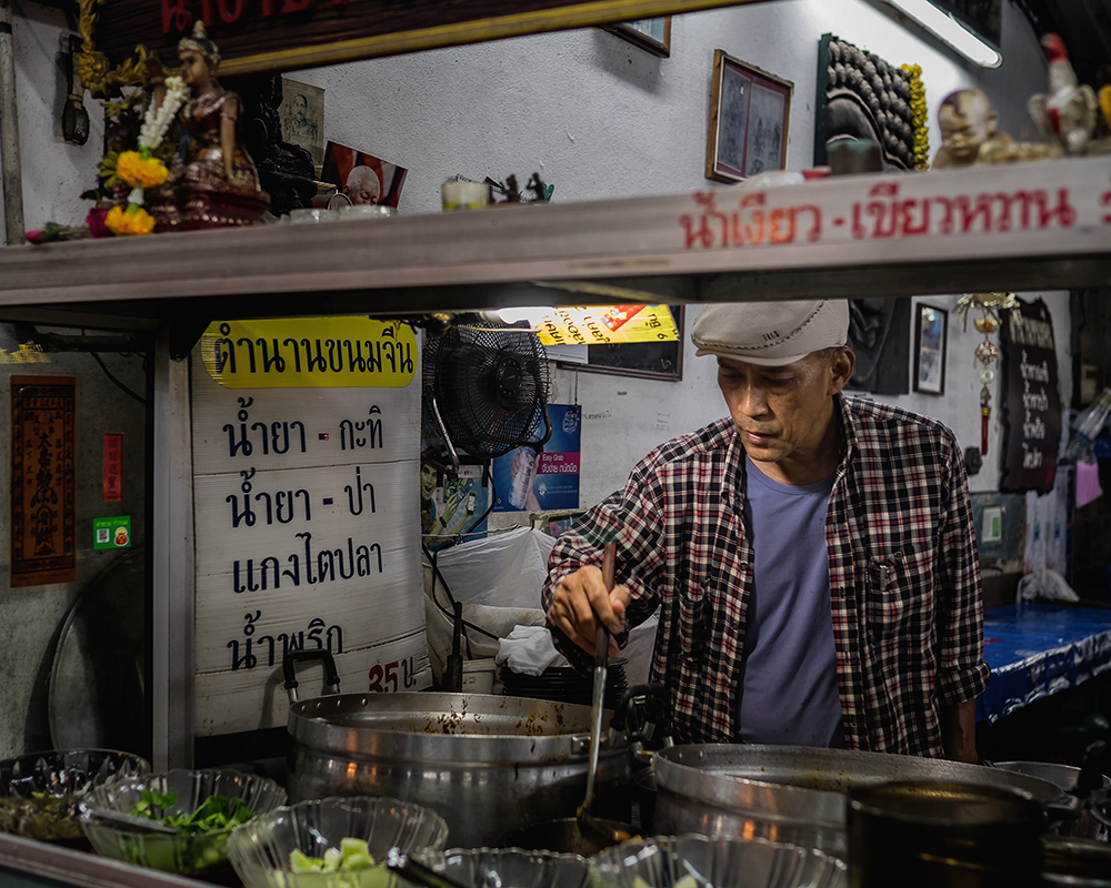 Night market man Bangkok Thailand