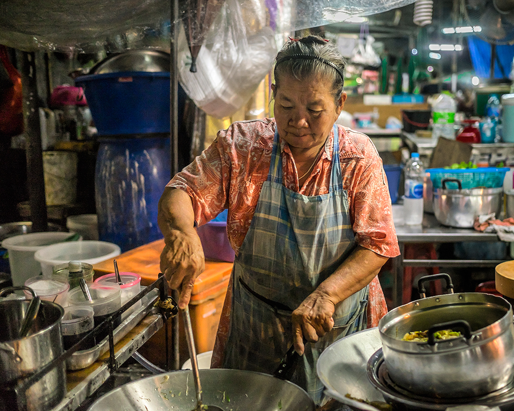 Night market woman Bangkok Thailand