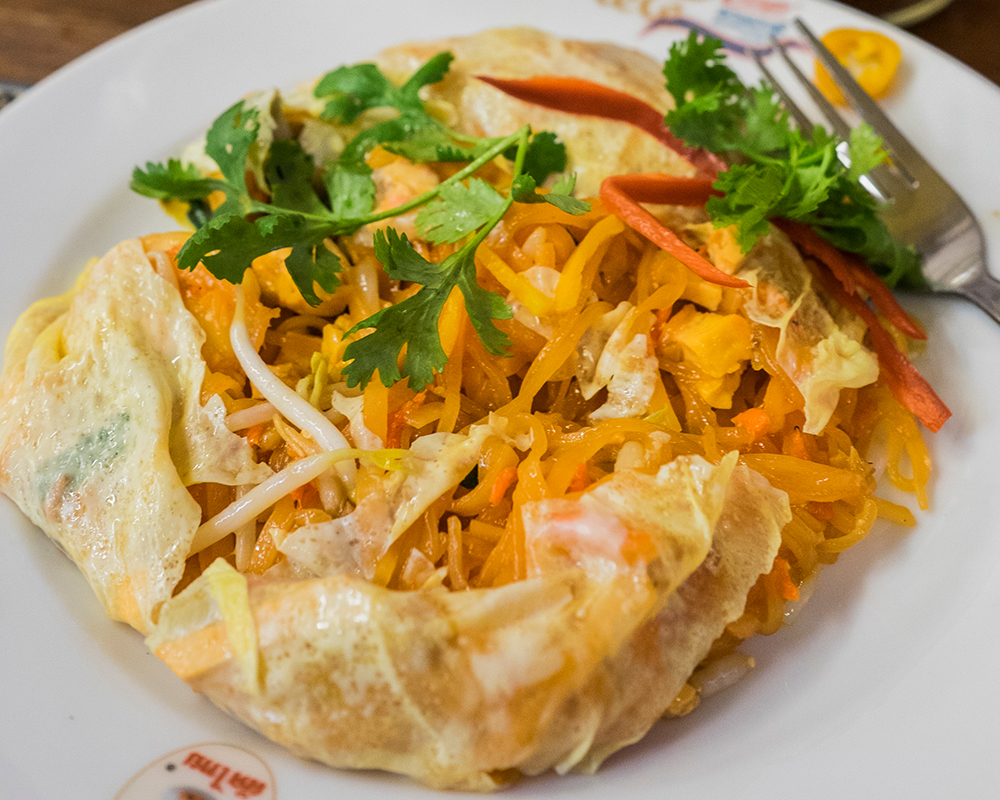 Thipsamai opened egg wrapped Pad Thai Bangkok Thailand