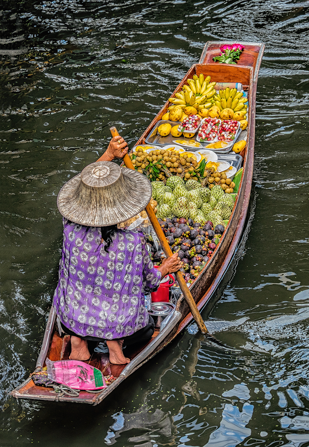 Damnoen Saduak Floating Market woman rowing fruit Bangkok Thailand