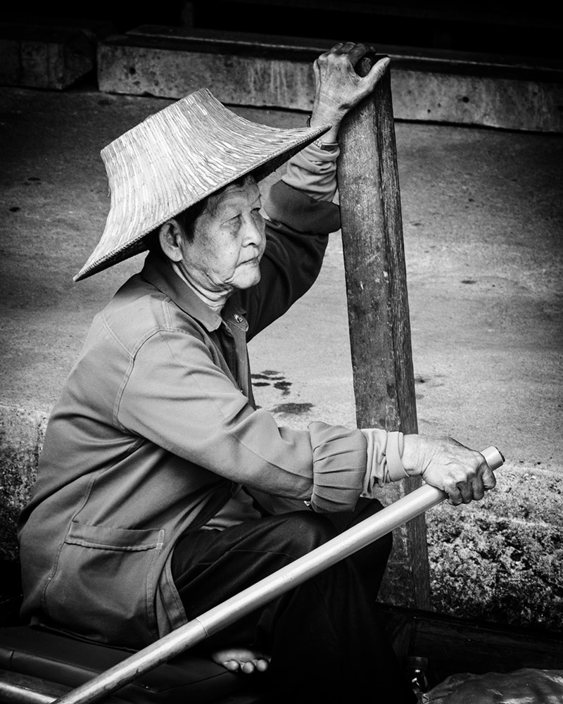 Damnoen Saduak floating market elderly woman hat Bangkok Thailand