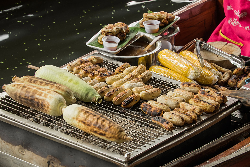 Damnoen Saduak floating market grilled corn Bangkok Thailand